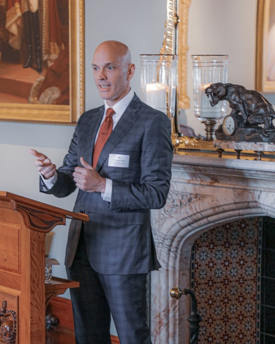 Ralph Ashton speaking at a lectern